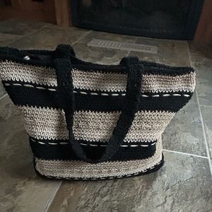 Black and tan and  cream colored crocheted pocketbook